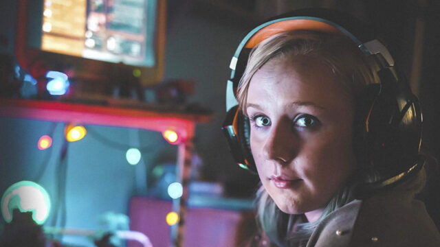 Dead Pixels Meg wearing headset